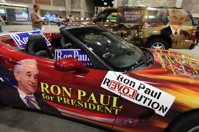 Two Ron Paul-mobiles sit at the center of the expo at P.A.U.L. Fest Saturday, Aug. 25, 2012, at the Florida State Fairgrounds.